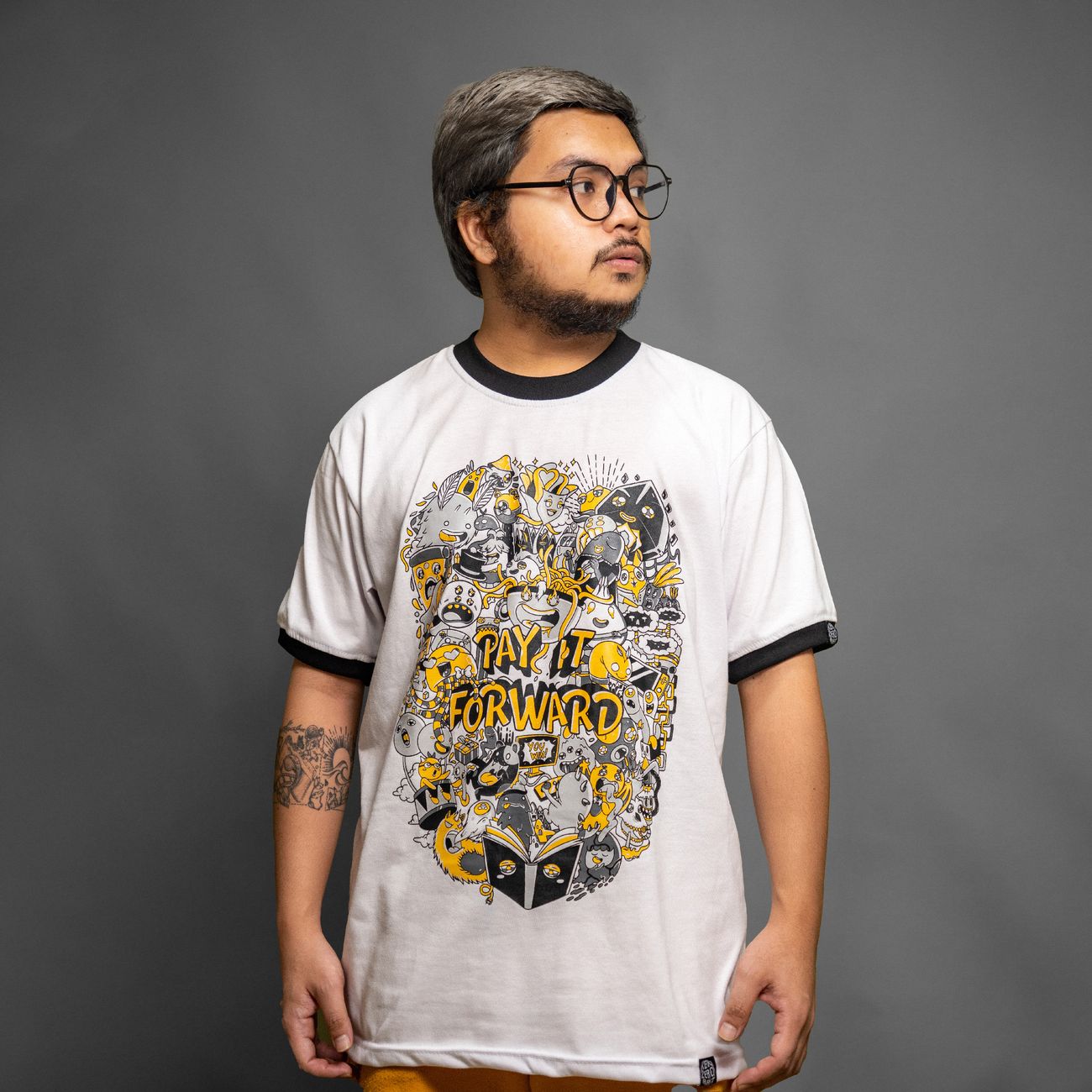 Sample: a printed slogan tee, worn, the text following the folds