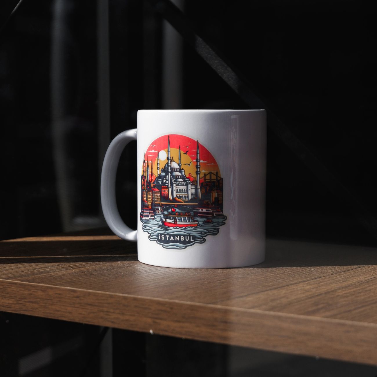 Sample: a mug with a detailed skyline print around its curve
